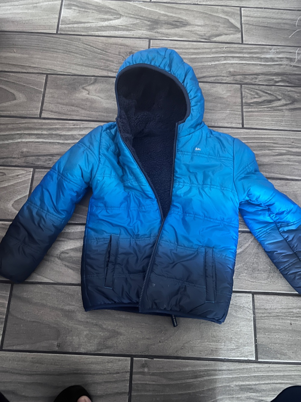 Children's jacket for cold waterproof and plush inside